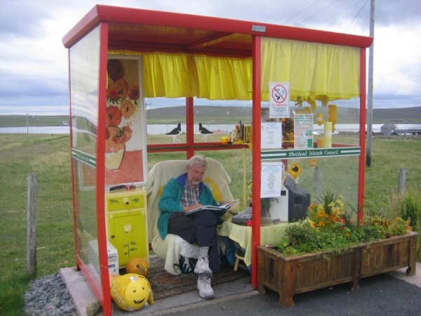 Tony Rogers relaxes in a bus shelter on Unst (photo: Brent Lynam)