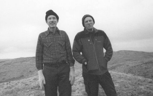 Phil Cooper (left) reaches 800 Marilyns on Cacra Hill (28B), in parallel with Alan Dawson on 900: an unplanned coincidence (photo: Mary Cox)