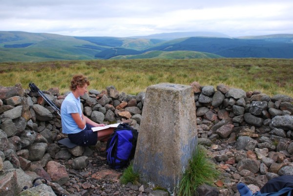 Frances Wilson and map on Shillhope Law (photo: Peter Wilson)